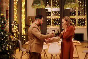 Man giving woman a gift